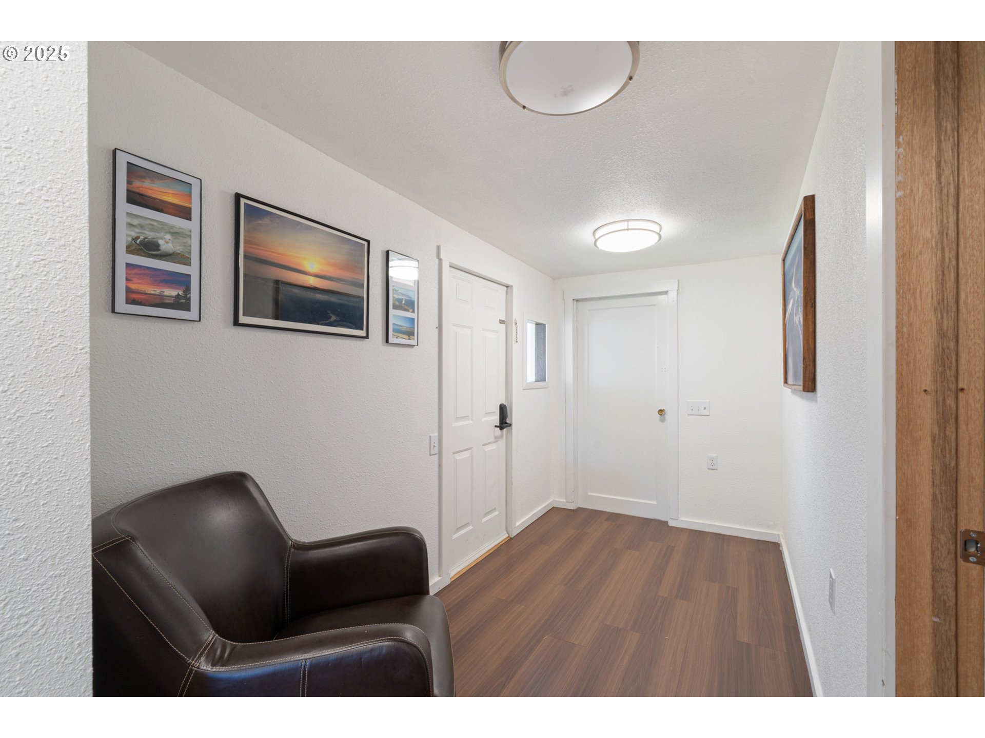 1195 3rd Street Netarts, OR 97141 - Photo 26 of 35 a hardwood floor in a room