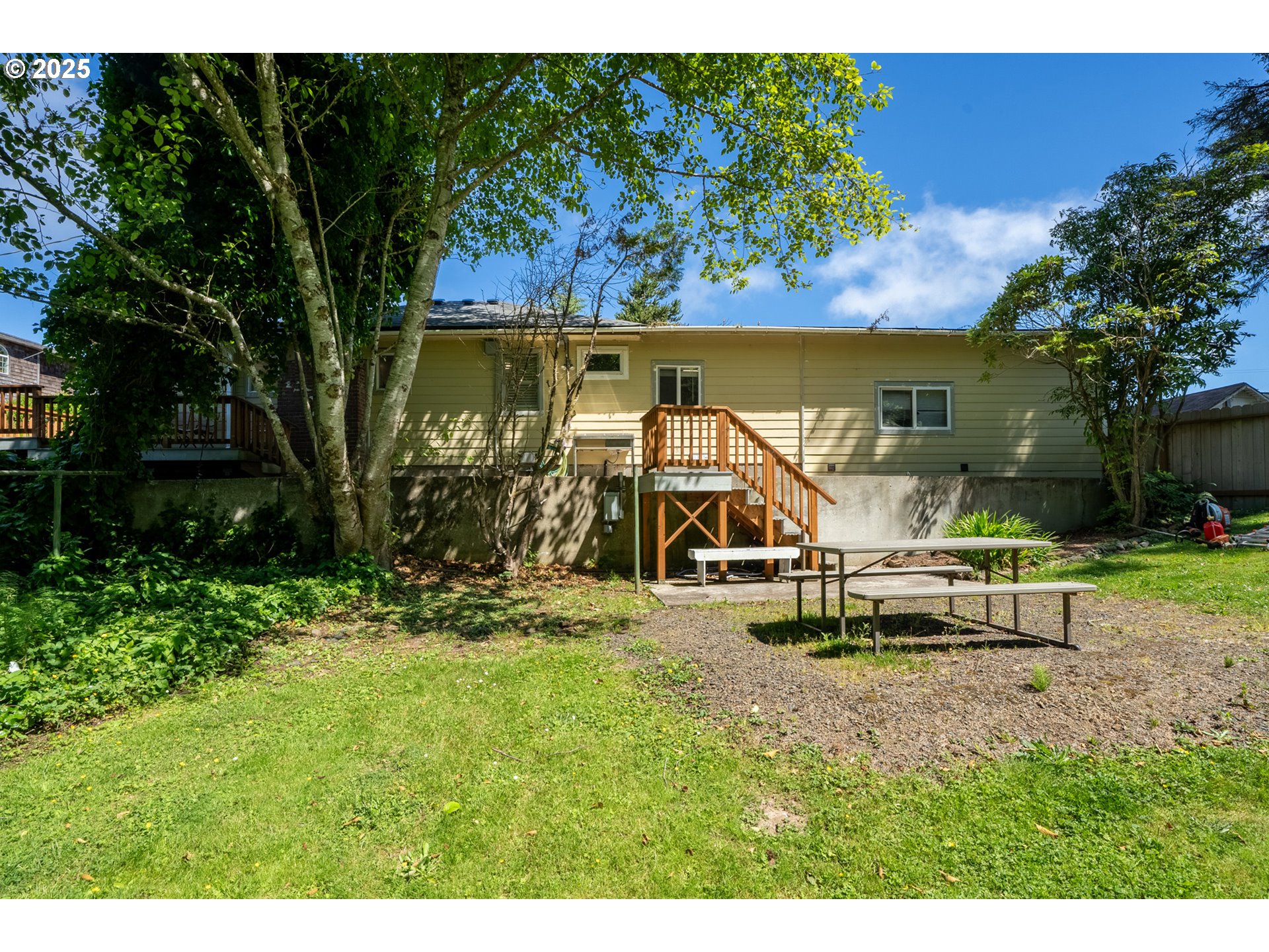 1195 3rd Street Netarts, OR 97141 - Photo 30 of 35 a view of a park with plants and a bench