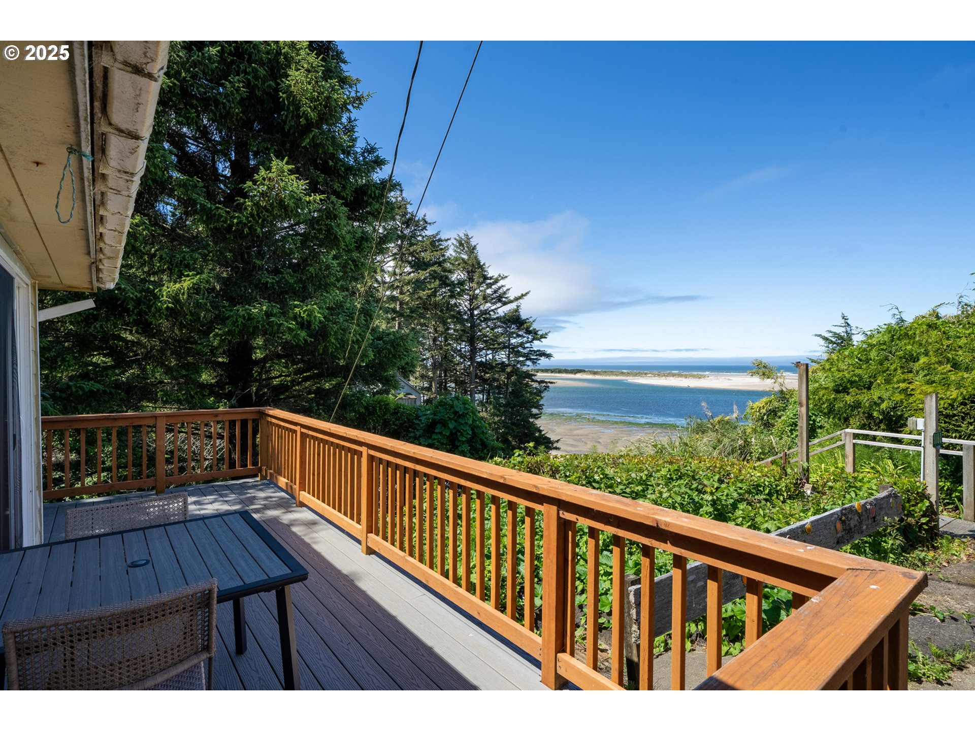 1195 3rd Street Netarts, OR 97141 - Photo 3 of 35 a view of balcony with wooden floor and outdoor seating