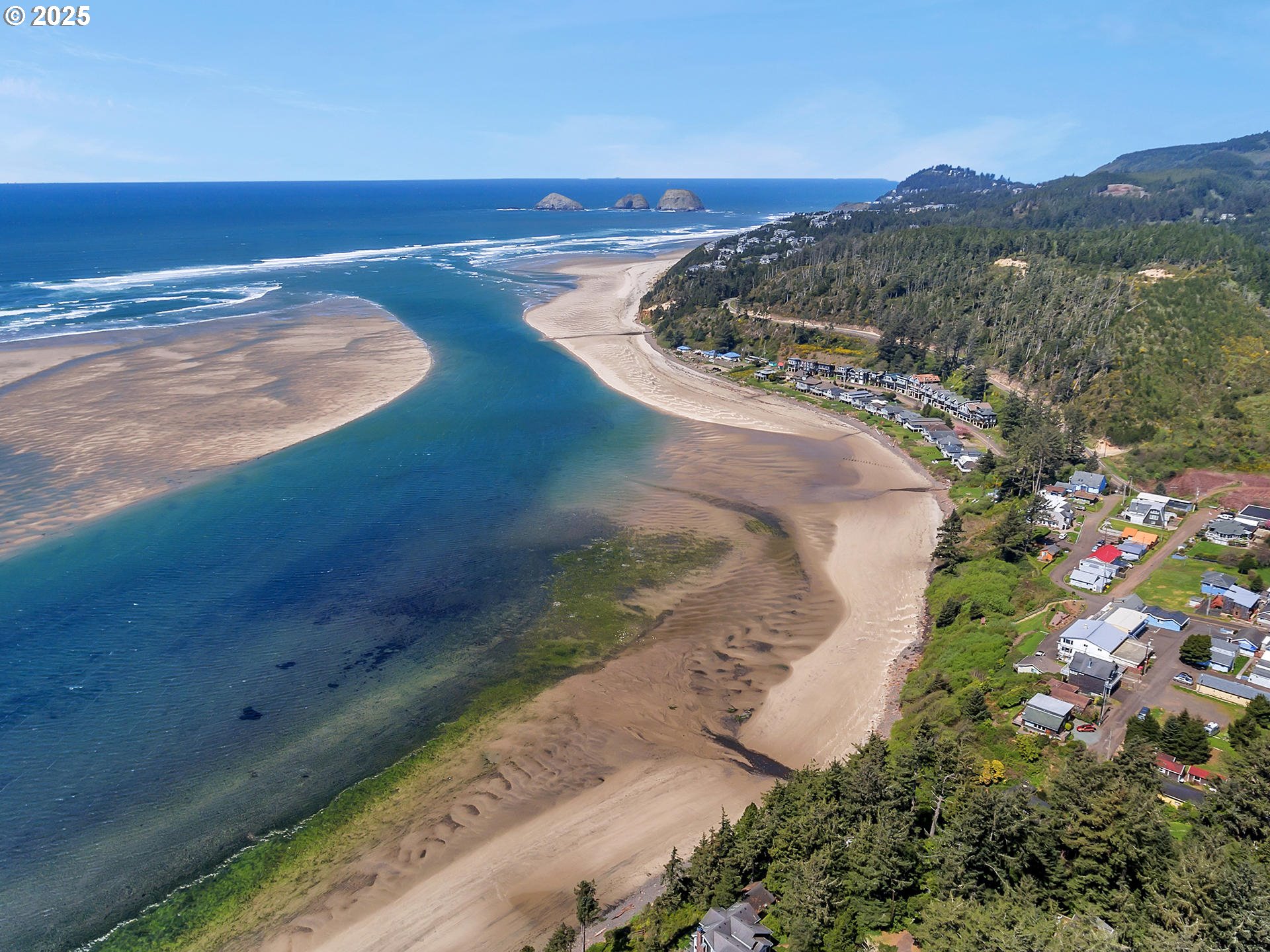1195 3rd Street Netarts, OR 97141 - Photo 33 of 35 a view of an ocean and a mountain