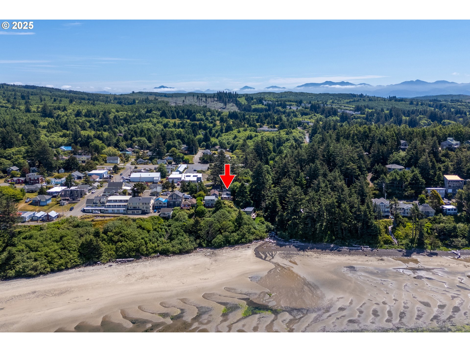 1195 3rd Street Netarts, OR 97141 - Photo 8 of 35 a view of a city and a mountain view