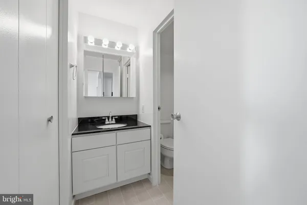 a white bath tub sitting next to a white toilet