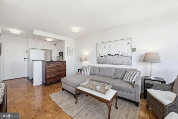 a living room with furniture and a rug