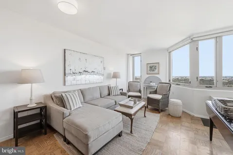 a living room with furniture and a large window