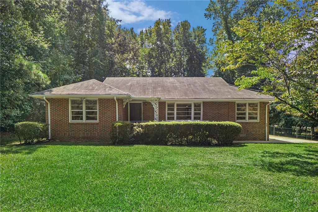 559 Ridge Avenue Mableton, GA 30126 - Photo 1 of 1 a front view of a house with a garden