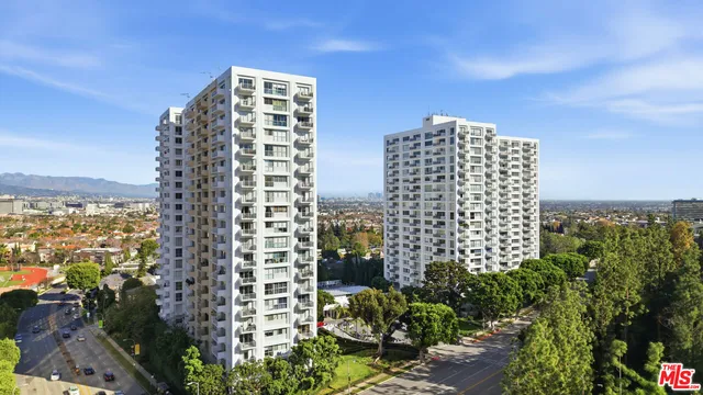 a view of swimming pool with outdoor seating and plants