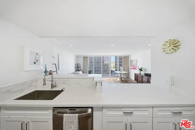 a kitchen with sink cabinets and window