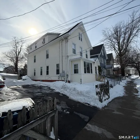 a view of a house with backyard