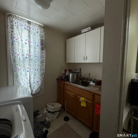 a kitchen with a cabinets and a stove