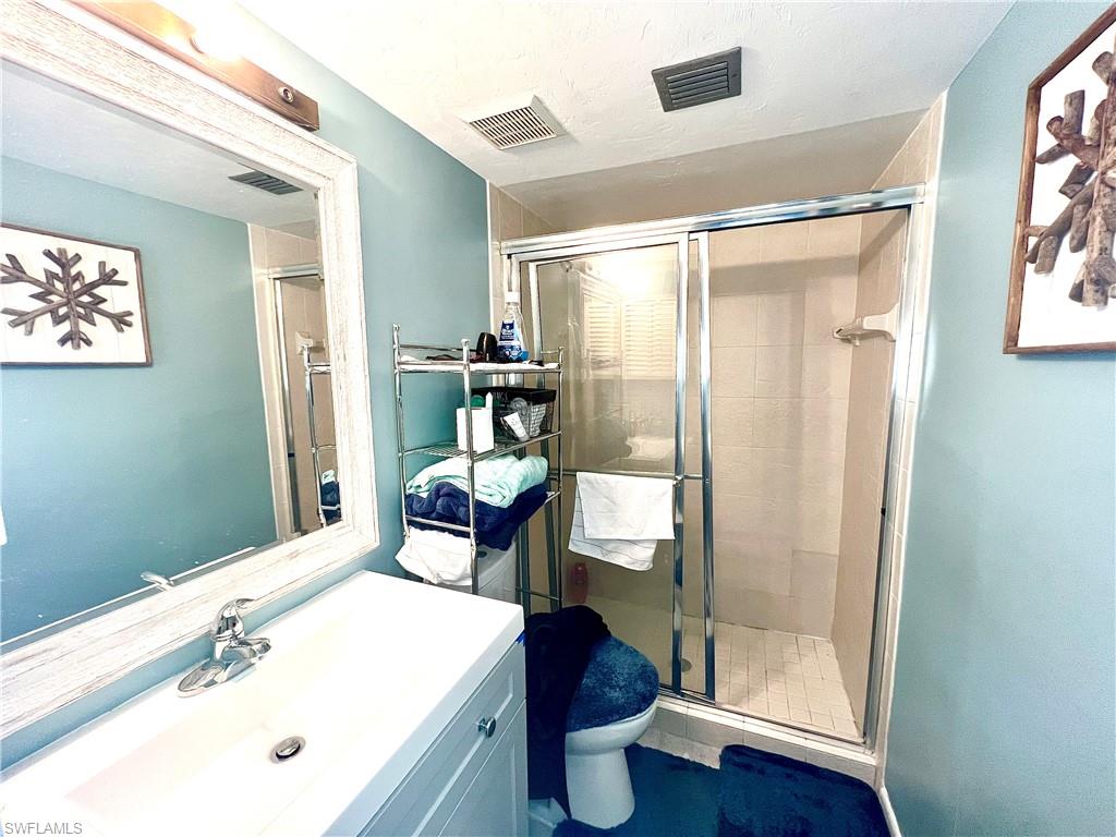 2207 San Marco Road, Unit 4104 Marco Island, FL 34145 - Photo 12 of 21 a bathroom with a sink and a mirror