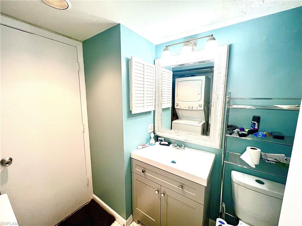 2207 San Marco Road, Unit 4104 Marco Island, FL 34145 - Photo 14 of 21 a bathroom with a sink toilet and a mirror
