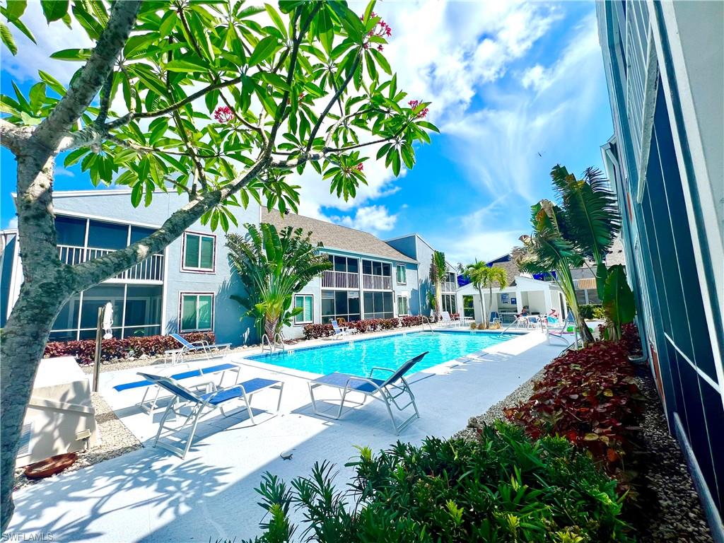 2207 San Marco Road, Unit 4104 Marco Island, FL 34145 - Photo 20 of 21 a view of a house with a yard