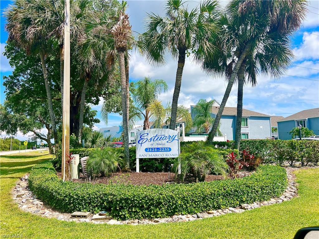 2207 San Marco Road, Unit 4104 Marco Island, FL 34145 - Photo 21 of 21 a view of a swimming pool with a garden and palm trees