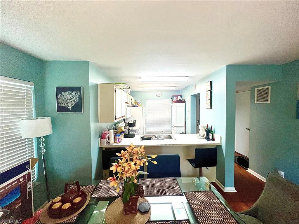 2207 San Marco Road, Unit 4104 Marco Island, FL 34145 - Photo 5 of 21 a room with furniture a rug and a window