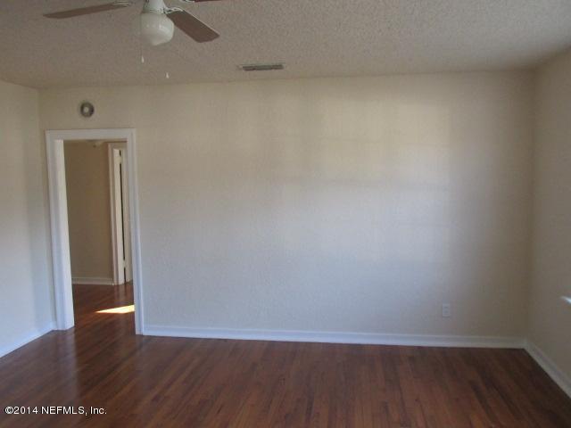 2105 Bayview Road Jacksonville, FL 32210 - Photo 4 of 10 a view of an empty room with wooden floor