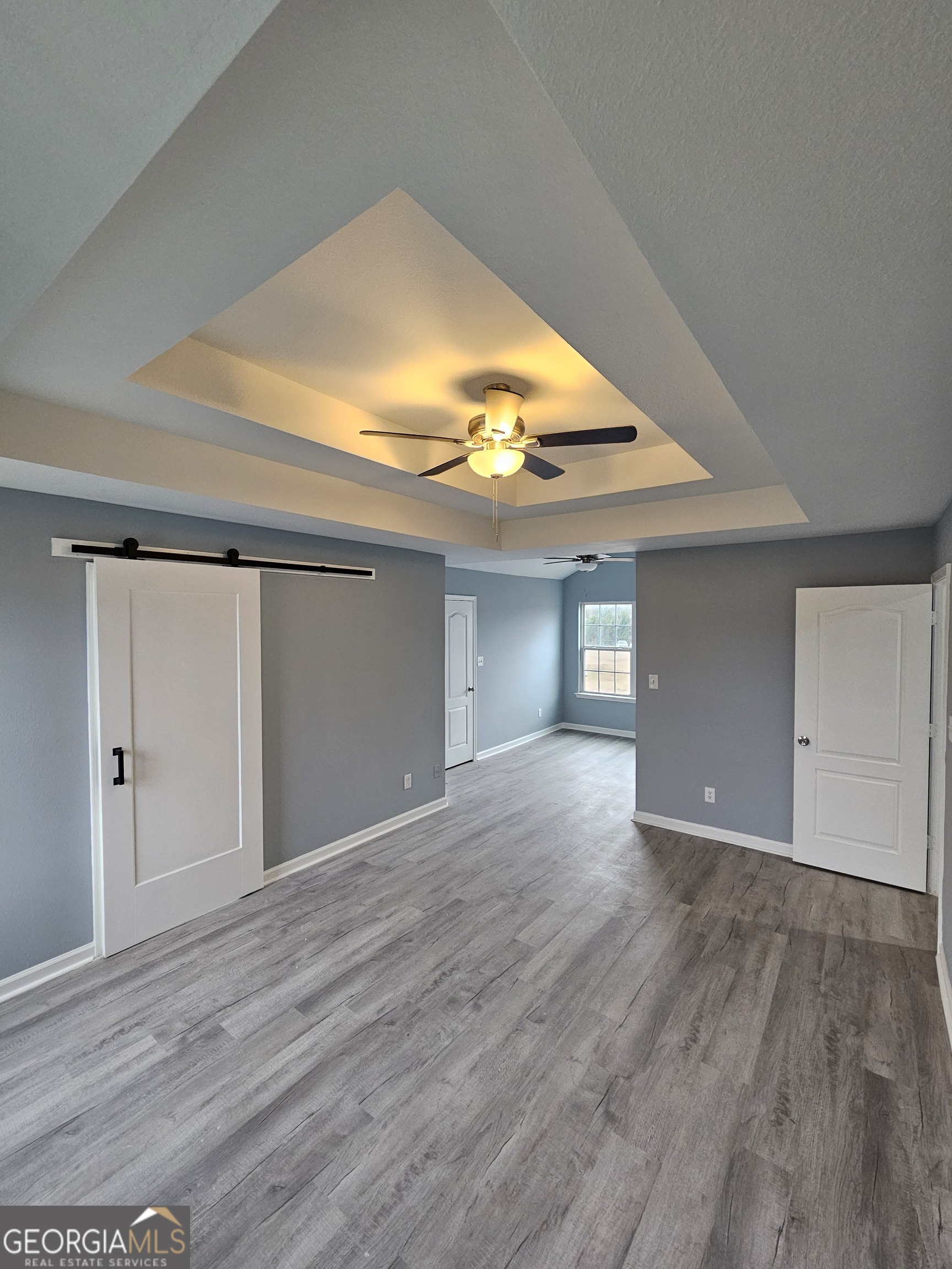 248 Sky Hawk Lane Macon, GA 31216 - Photo 6 of 6 a view of an empty room and wooden floor