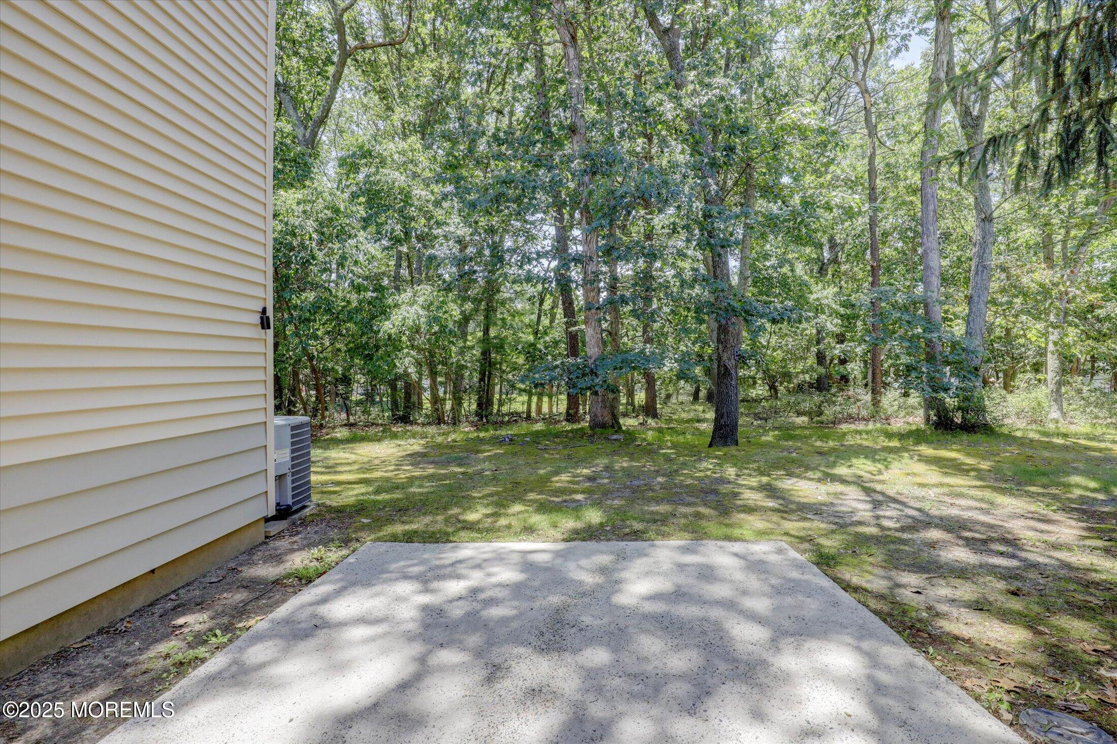 95 Azalea Circle Jackson, NJ 08527 - Photo 43 of 62 a view of a backyard with trees