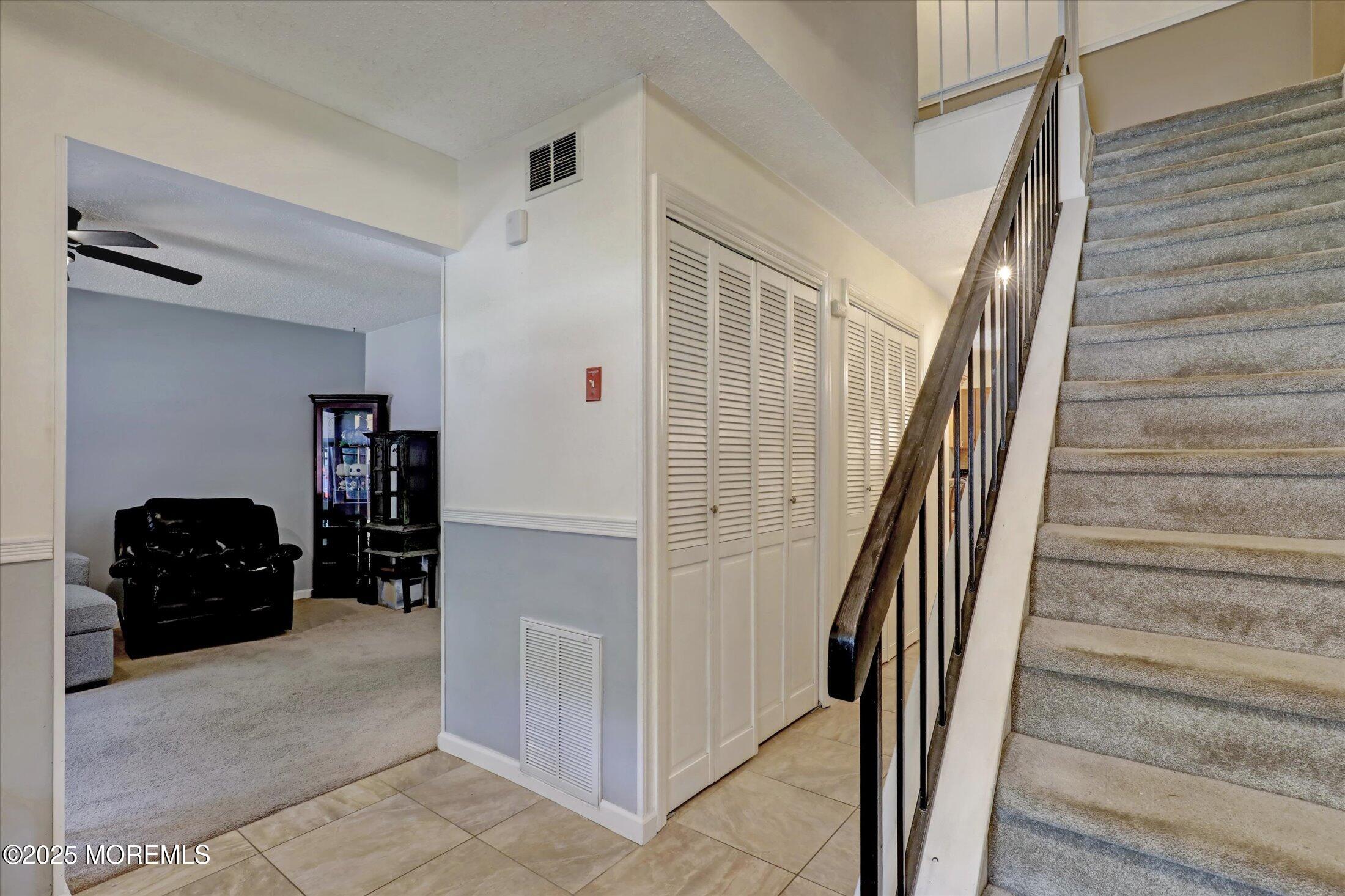 95 Azalea Circle Jackson, NJ 08527 - Photo 6 of 62 a view of a livingroom with furniture and stairs