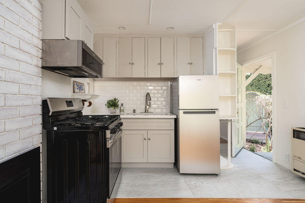 2605 Bath Street Santa Barbara, CA 93105 - Photo 12 of 20 a kitchen with a sink a refrigerator and a stove
