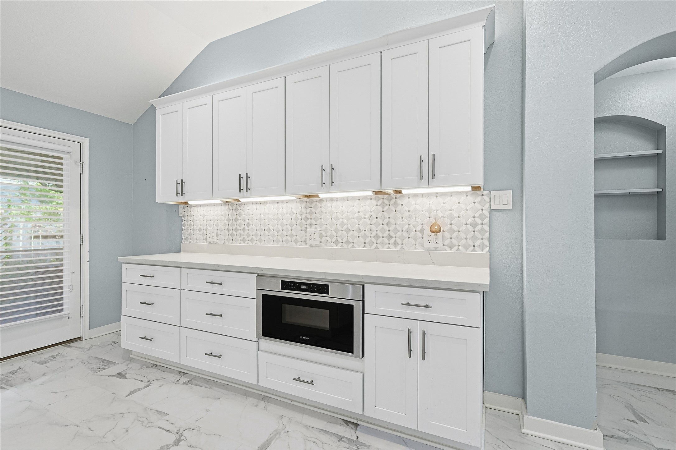 962 Oak Falls Drive Conroe, TX 77378 - Photo 14 of 28 a view of white cabinets and window