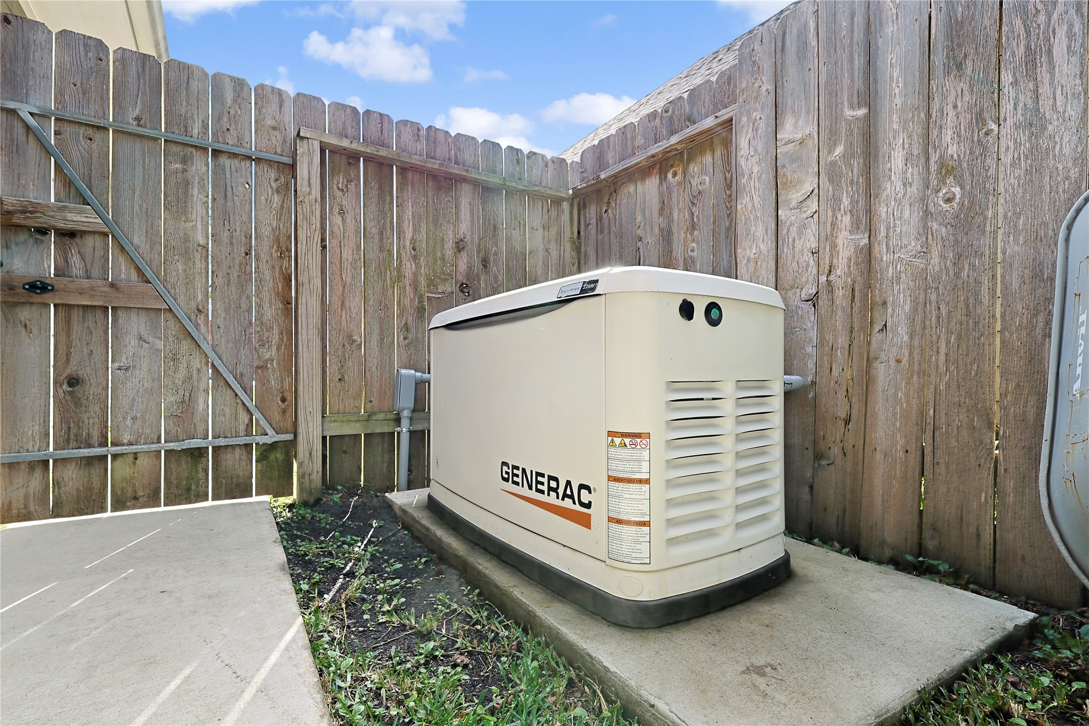 962 Oak Falls Drive Conroe, TX 77378 - Photo 2 of 28 a view of a back yard of the house with a wooden fence