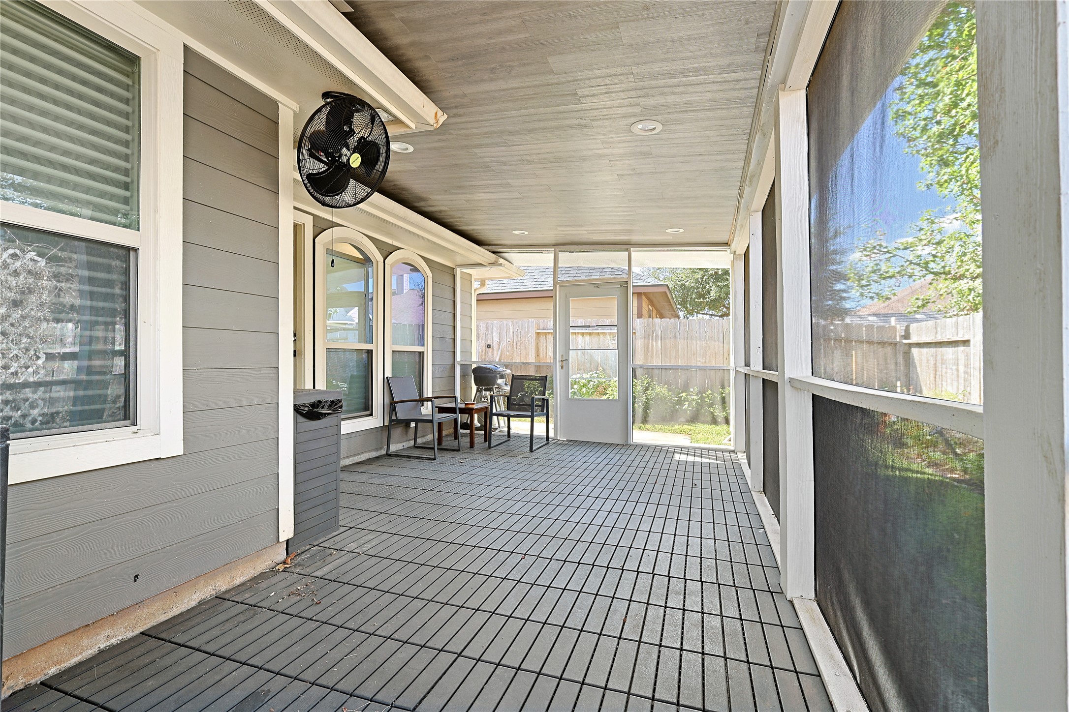 962 Oak Falls Drive Conroe, TX 77378 - Photo 25 of 28 a view of a porch with wooden floor and furniture
