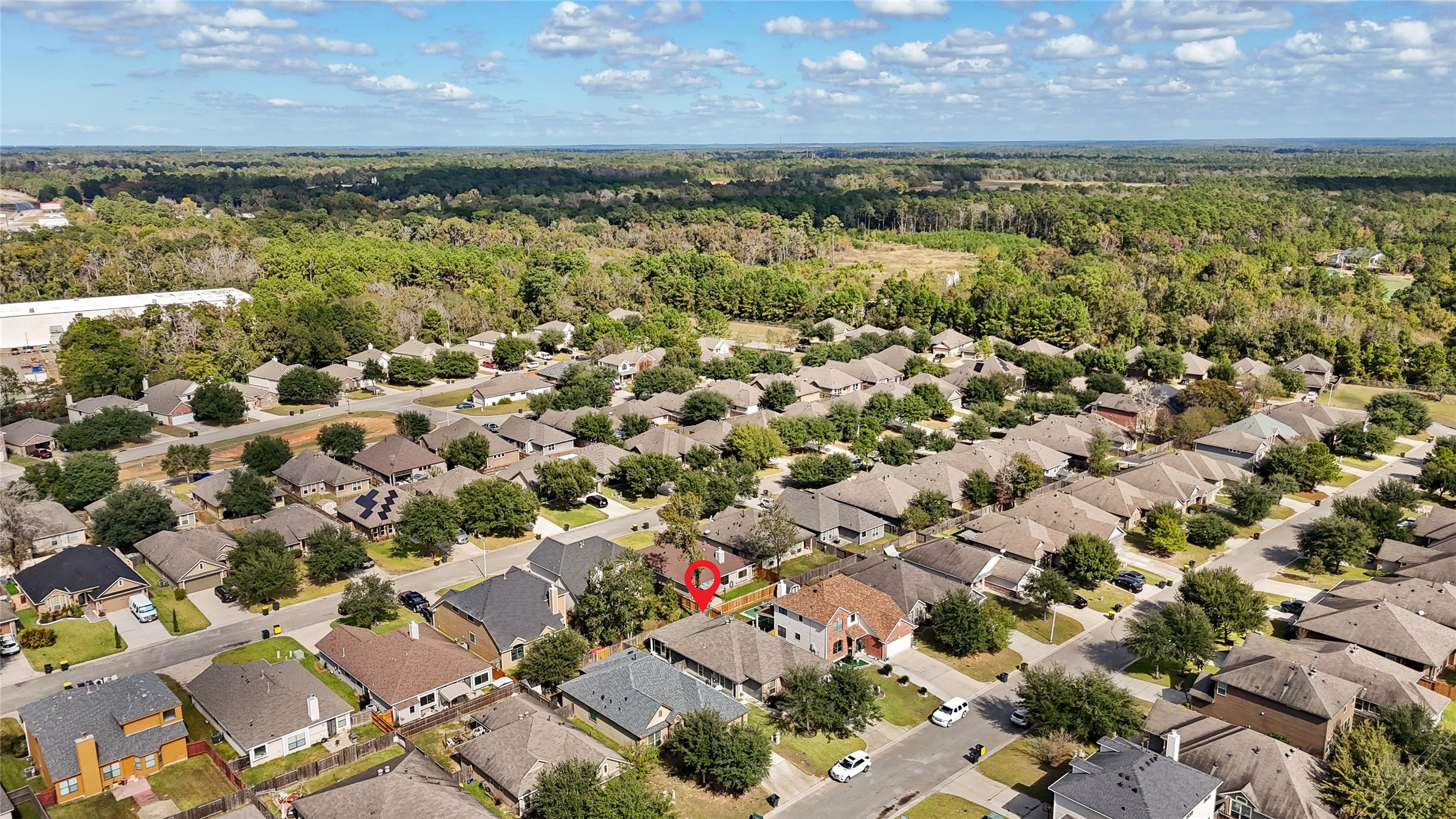 962 Oak Falls Drive Conroe, TX 77378 - Photo 27 of 28 an aerial view of a houses with a lake view