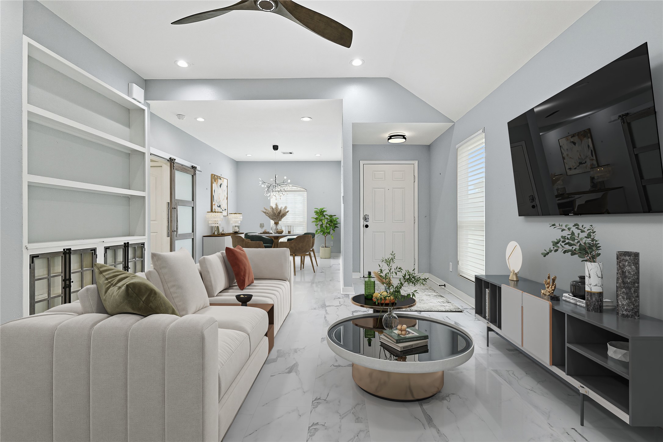 962 Oak Falls Drive Conroe, TX 77378 - Photo 3 of 28 a living room with furniture and a flat screen tv