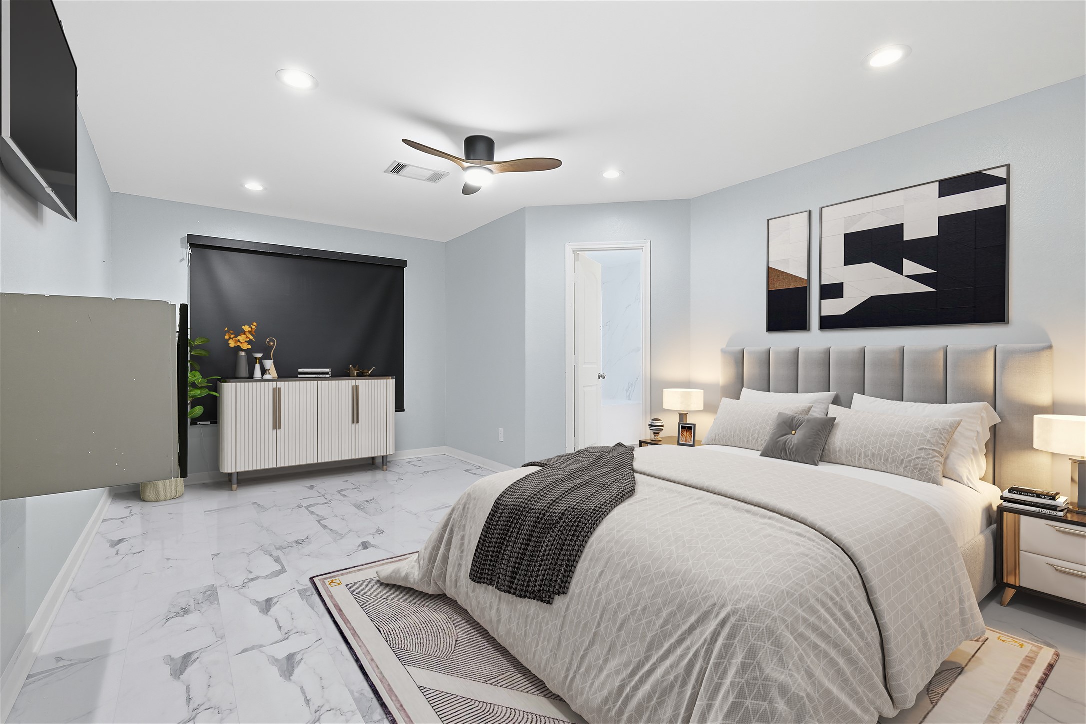 962 Oak Falls Drive Conroe, TX 77378 - Photo 7 of 28 a bedroom with a large bed and a flat screen tv