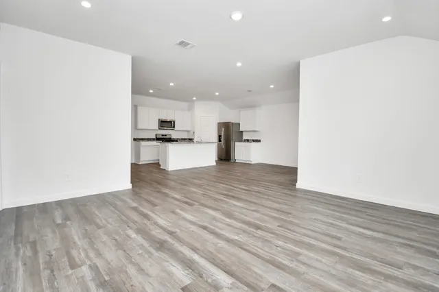 a view of kitchen with wooden floor