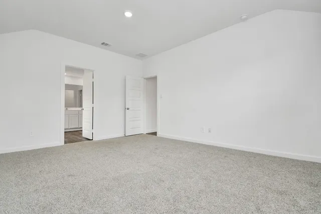 an empty room with closet area