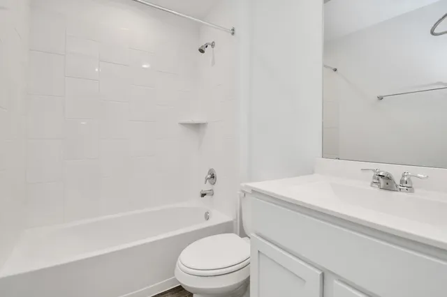 a bathroom with a sink a toilet and a bathtub