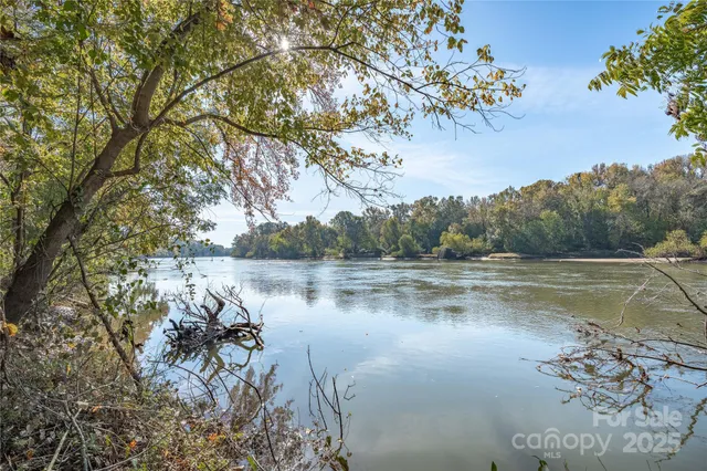 a view of lake with green space