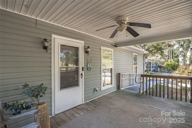 a view of a porch with wooden floor and outdoor space