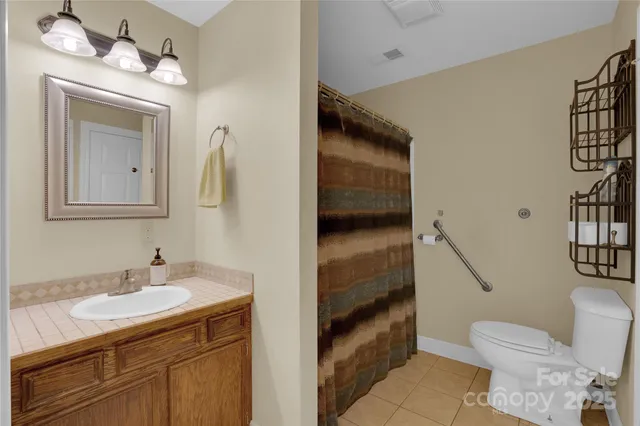 a view of room with entryway wooden floor and windows