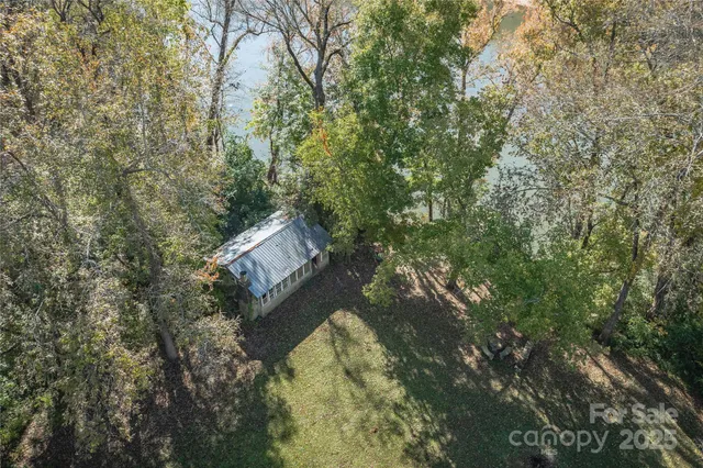 a backyard of a house with lots of trees