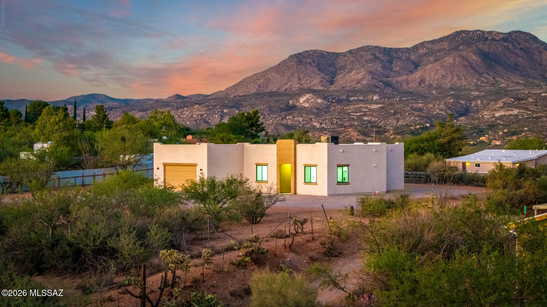 4601 East Magoo Road Tucson, AZ 85739 - Photo 32 of 38 a view of a house with a street and a yard