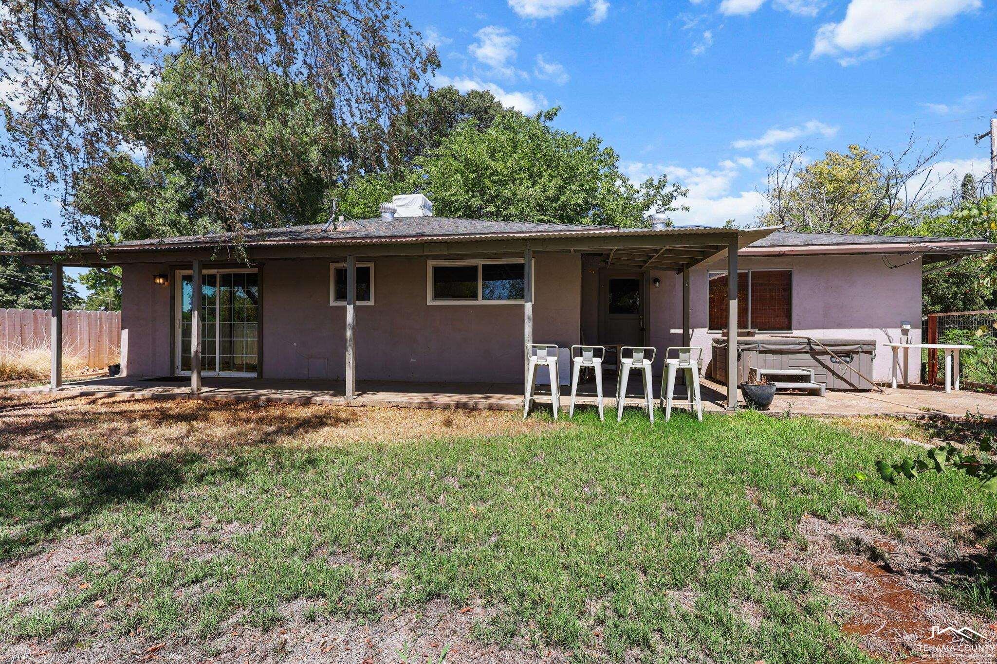 22275 Brent Road Red Bluff, CA 96080 - Photo 26 of 47 a backyard of a house with table and chairs