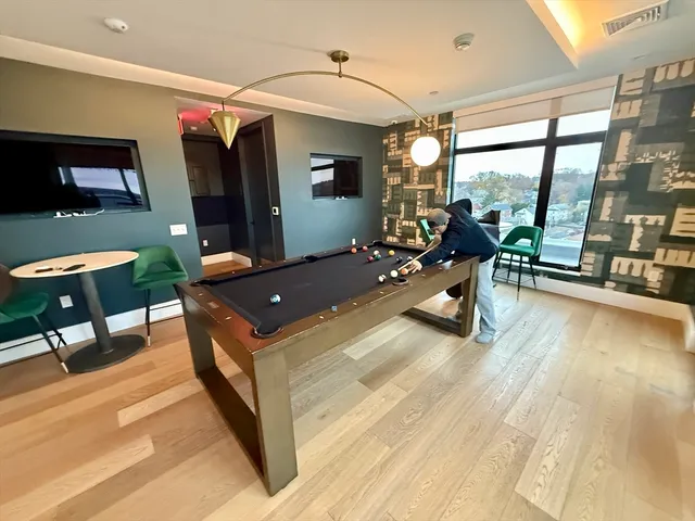 a bed room with a bed and glass door