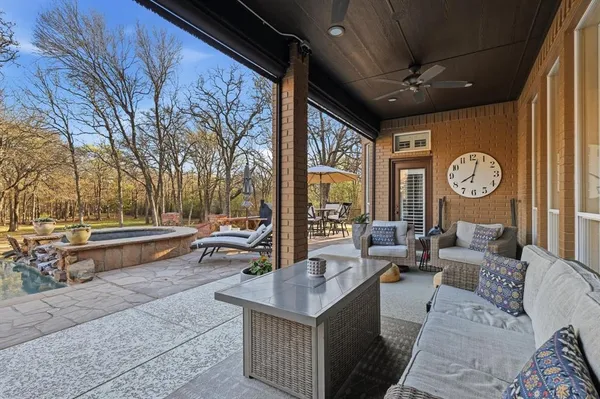 a front view of a house with a yard table and chairs