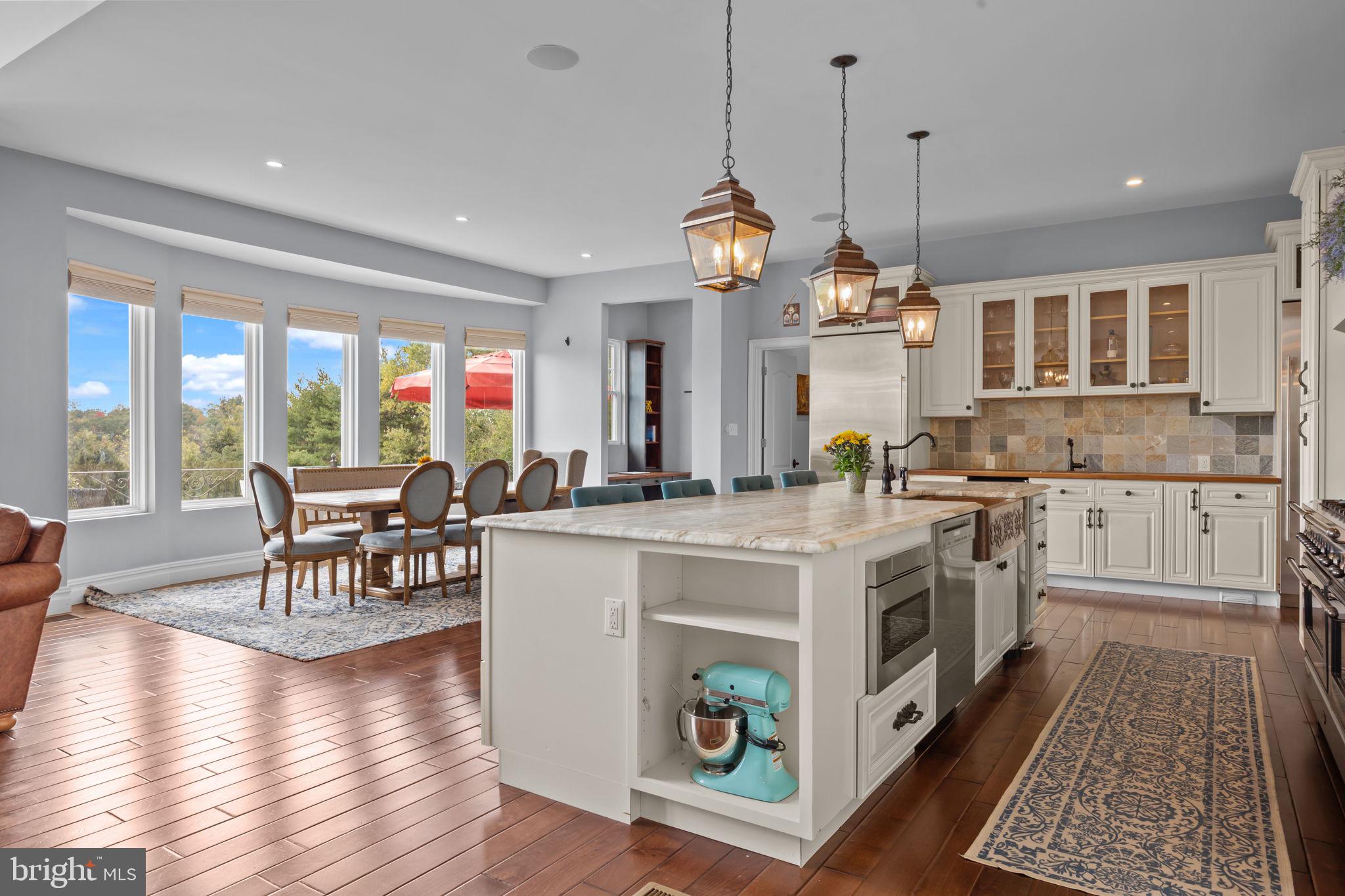 274 Pineville Road Newtown, PA 18940 - Photo 22 of 108 a large kitchen with stainless steel appliances granite countertop a stove and wooden floor