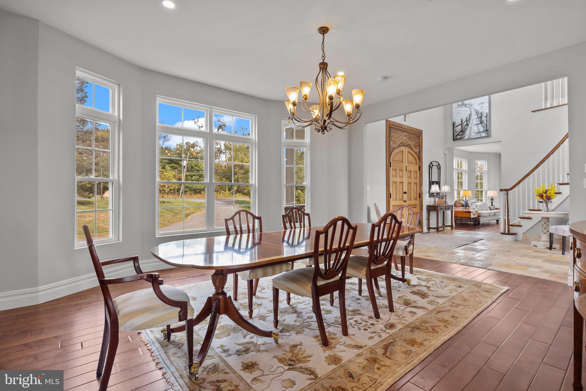 274 Pineville Road Newtown, PA 18940 - Photo 31 of 109 a view of a dining room with furniture window and wooden floor