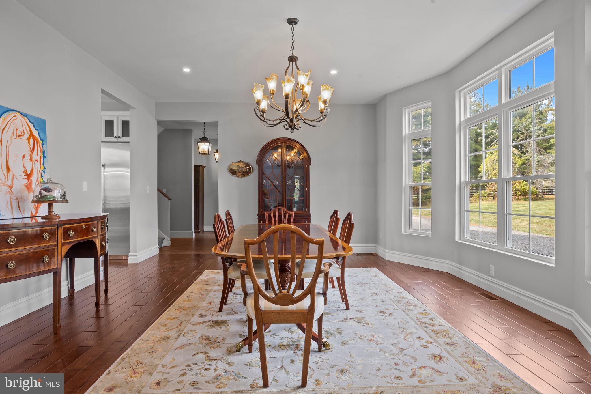 274 Pineville Road Newtown, PA 18940 - Photo 33 of 108 a view of a dining room with furniture window and wooden floor