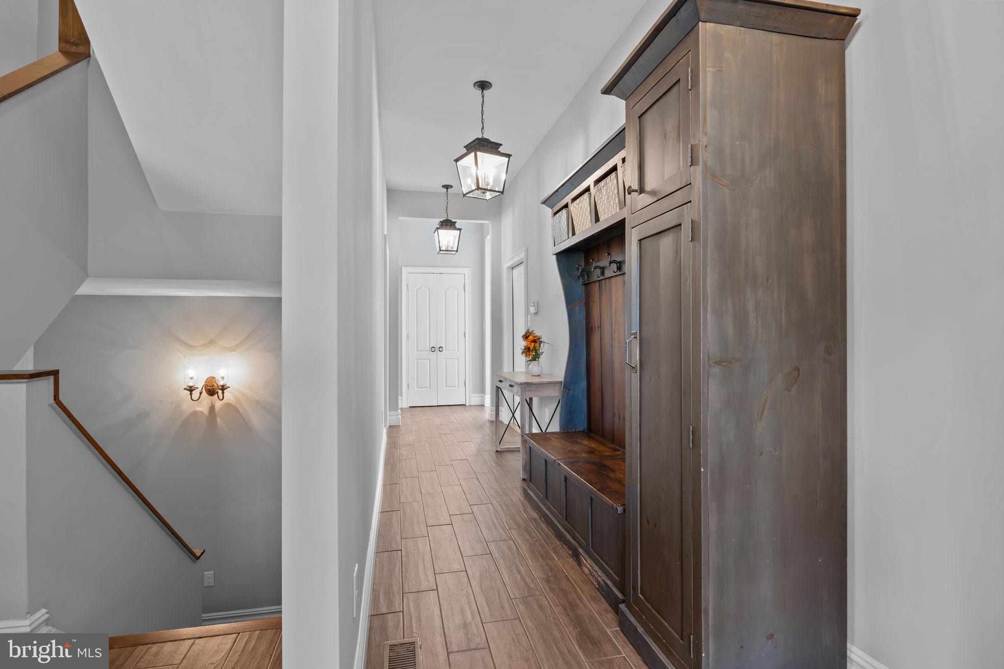 274 Pineville Road Newtown, PA 18940 - Photo 38 of 109 a view of a hallway view with wooden floor and staircase