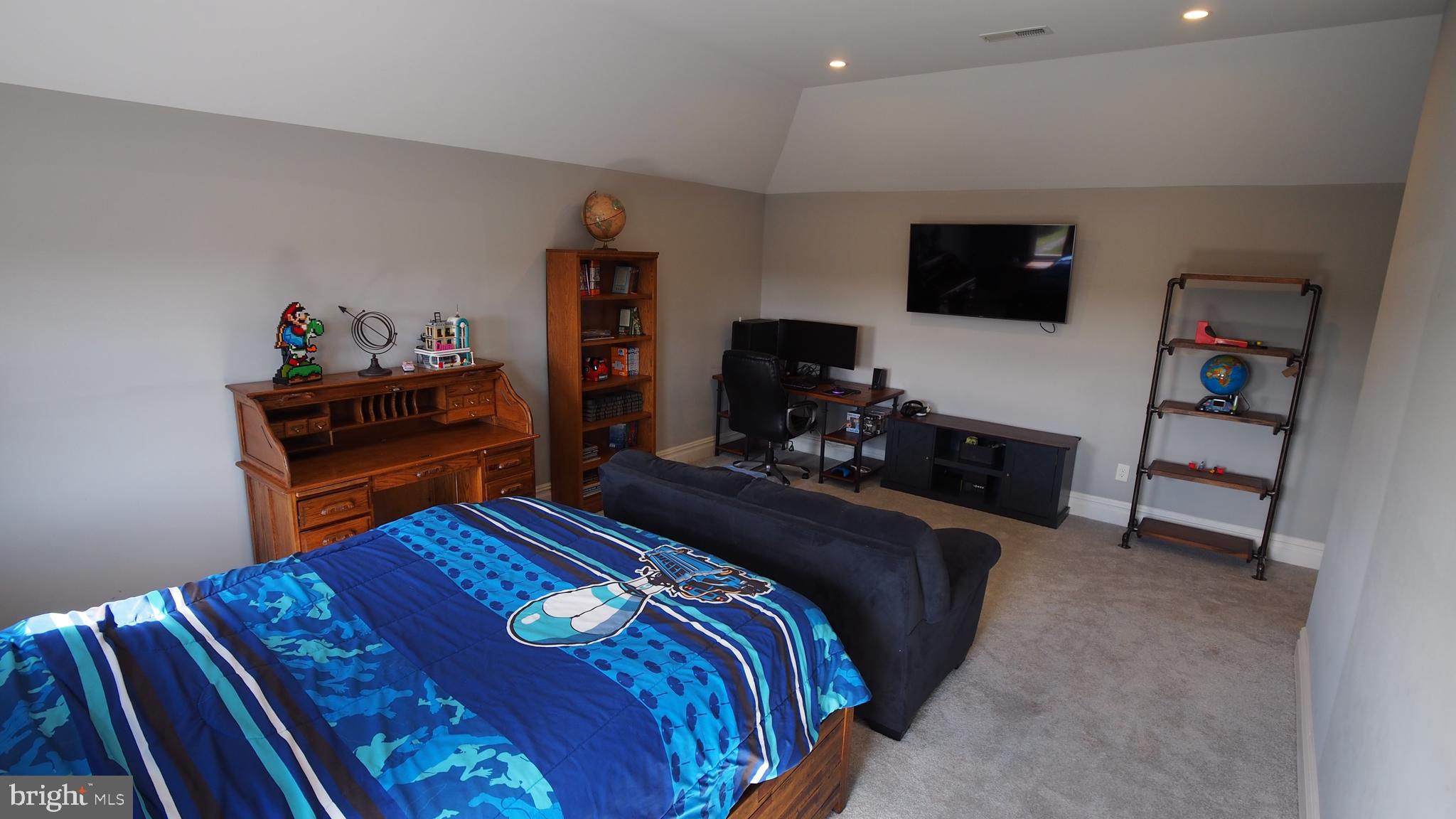274 Pineville Road Newtown, PA 18940 - Photo 40 of 109 a bedroom with a bed and flat screen tv
