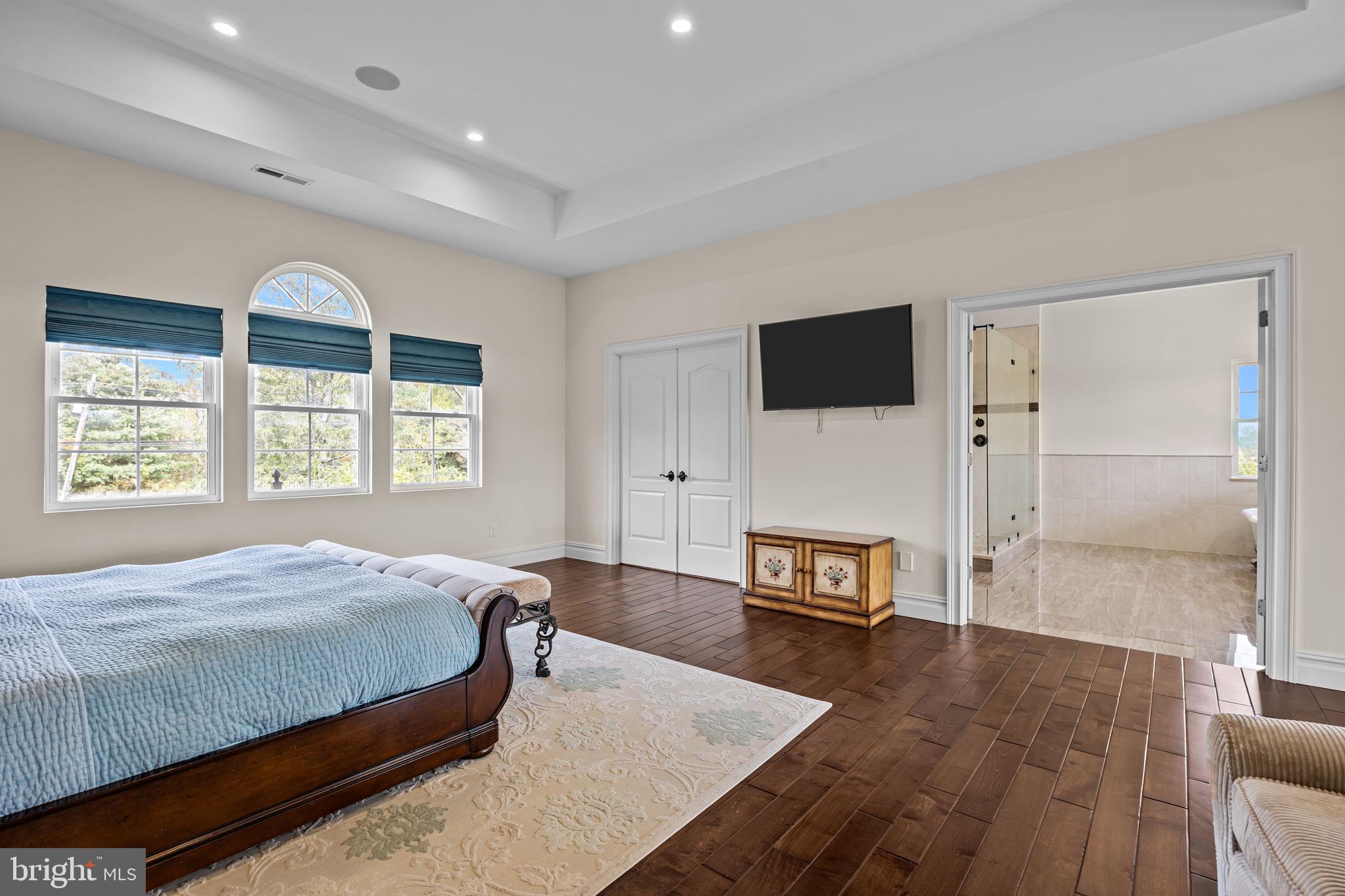 274 Pineville Road Newtown, PA 18940 - Photo 55 of 109 a bedroom with a bed and a flat screen tv