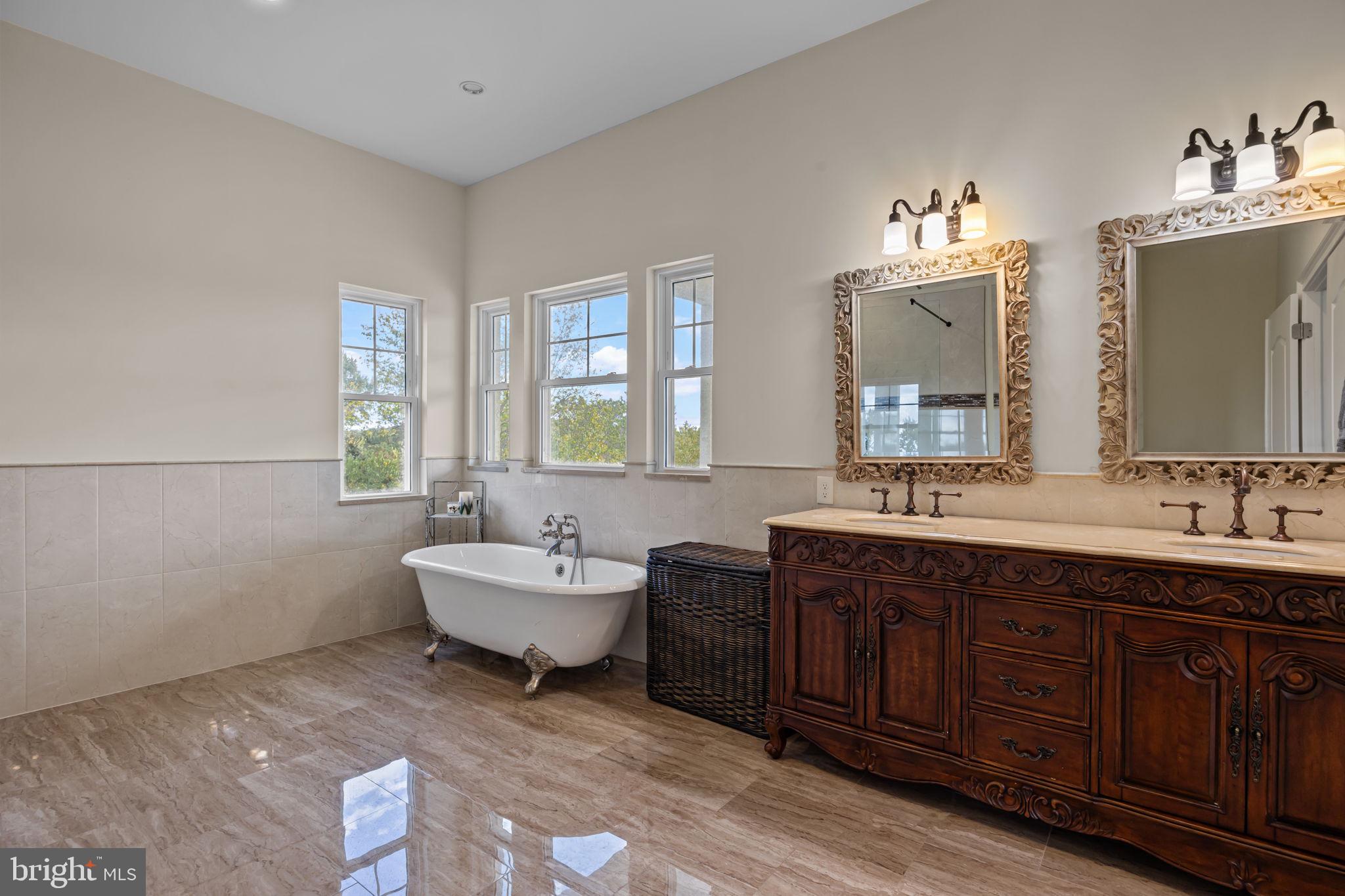 274 Pineville Road Newtown, PA 18940 - Photo 60 of 109 a spacious bathroom with a double vanity sink double mirror and bathtub