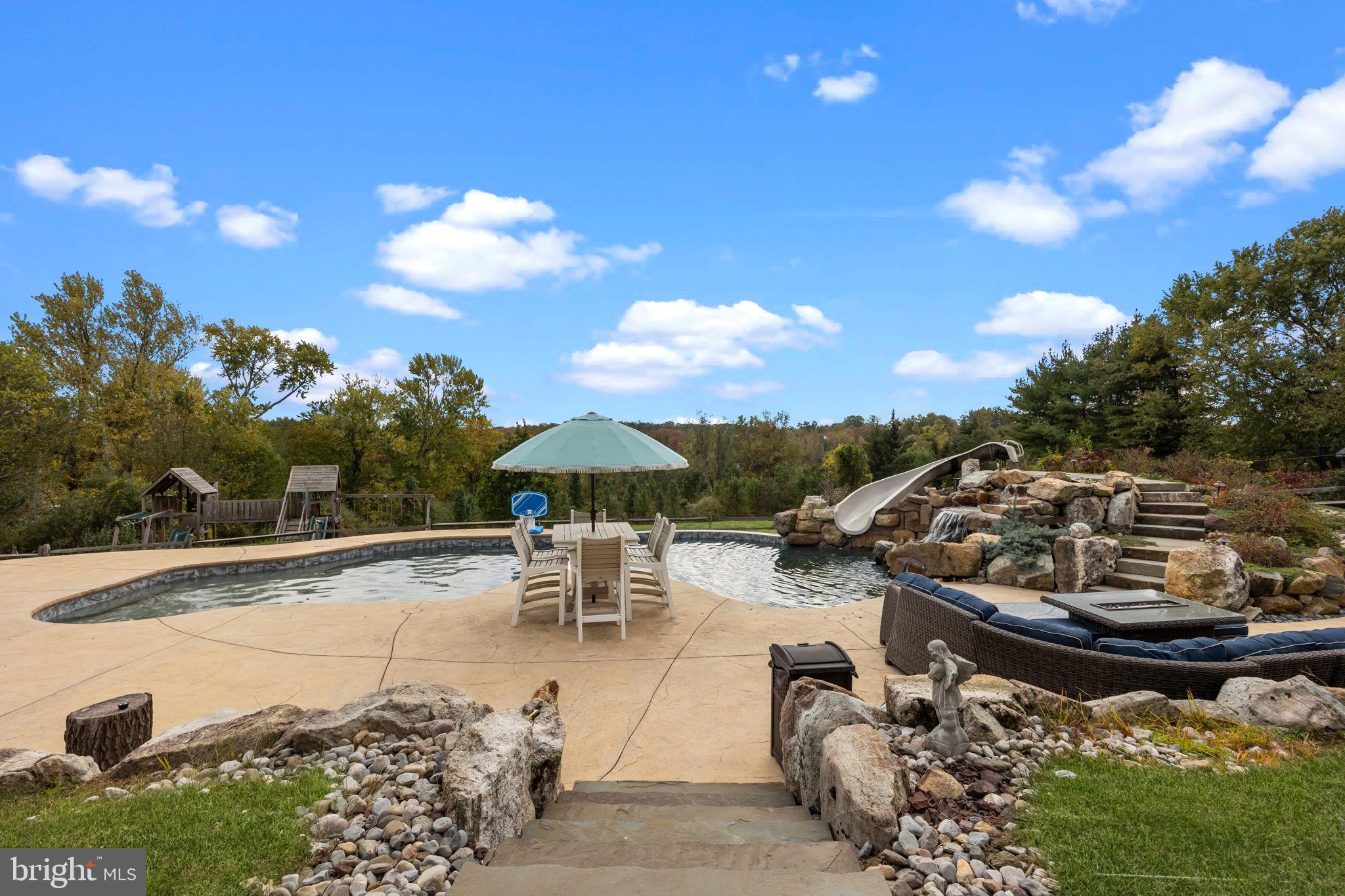 274 Pineville Road Newtown, PA 18940 - Photo 91 of 109 a view of a swimming pool and lounge chairs
