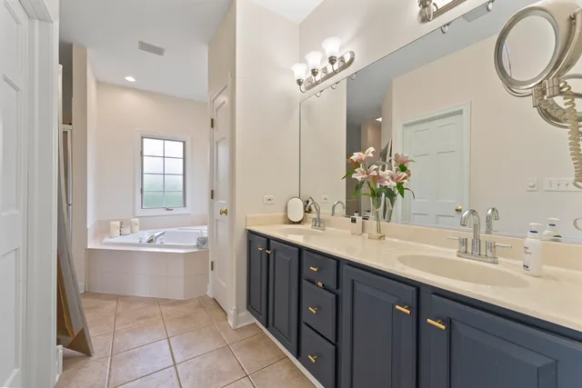 a bathroom with a tub a toilet and a sink