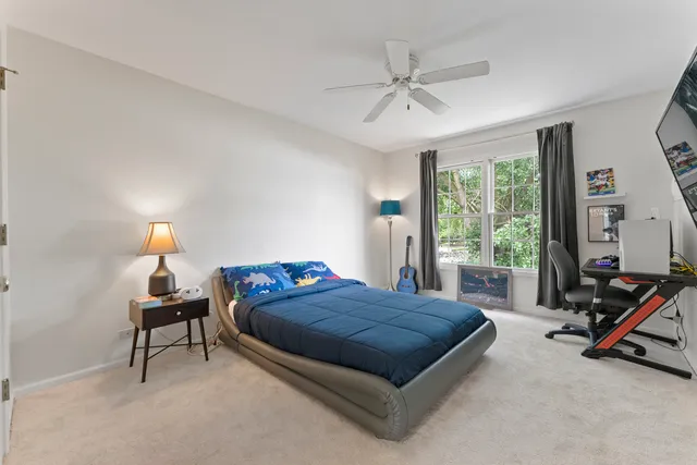 a bed room with a bed and a tv